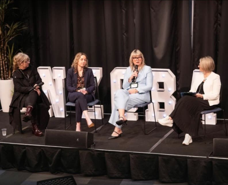 The State of Play panel at the New Zealand Qualified Bookkeepers Association conference. Left to right: Mel Curwood holding the microphone, Chantelle Good of Varntige, Tracey Turner of Inland Revenue, and host Lauren Parsons.