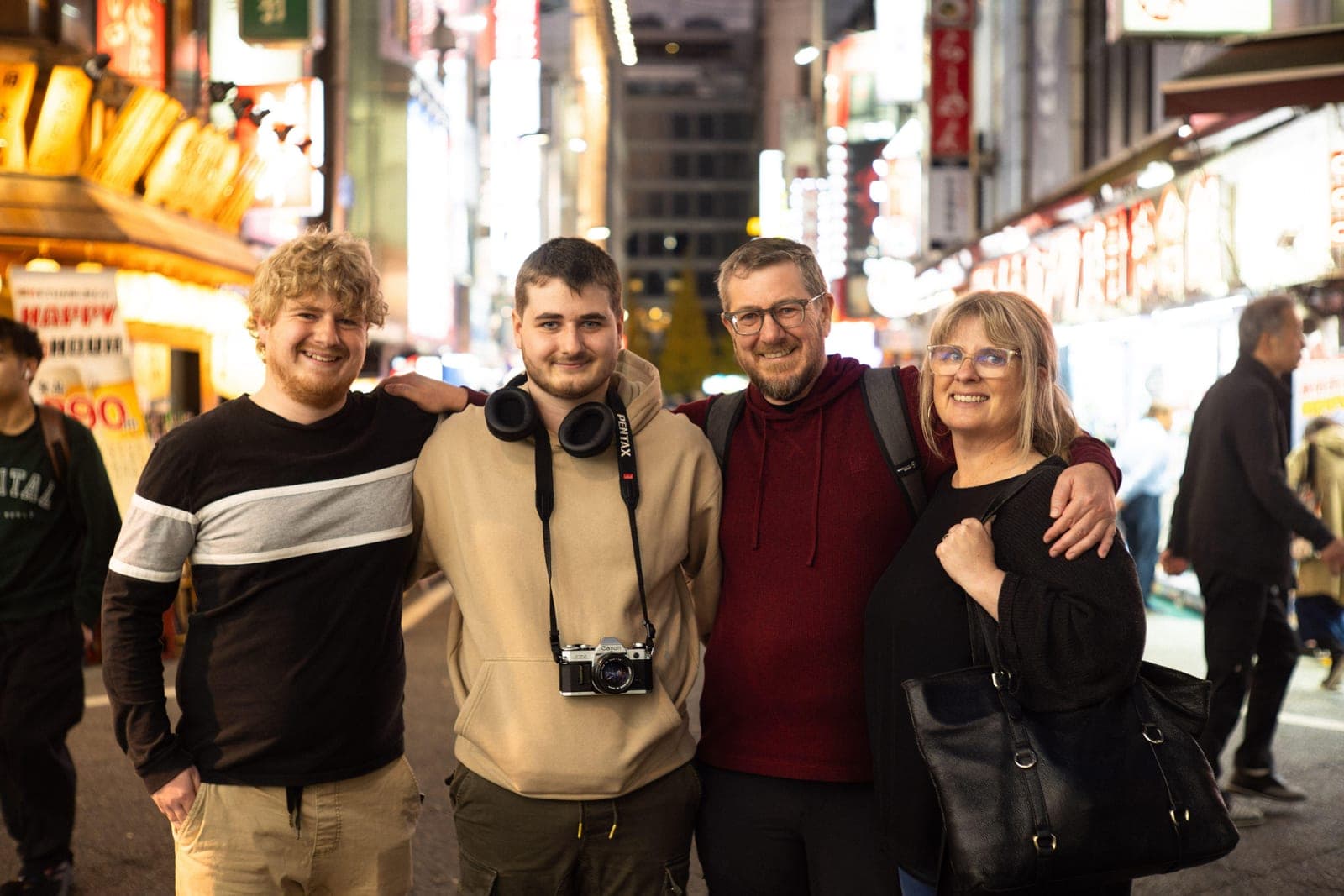 Mel Curwood with her husband and their two sons on a street in Japan, November 2025, celebrating his recovery